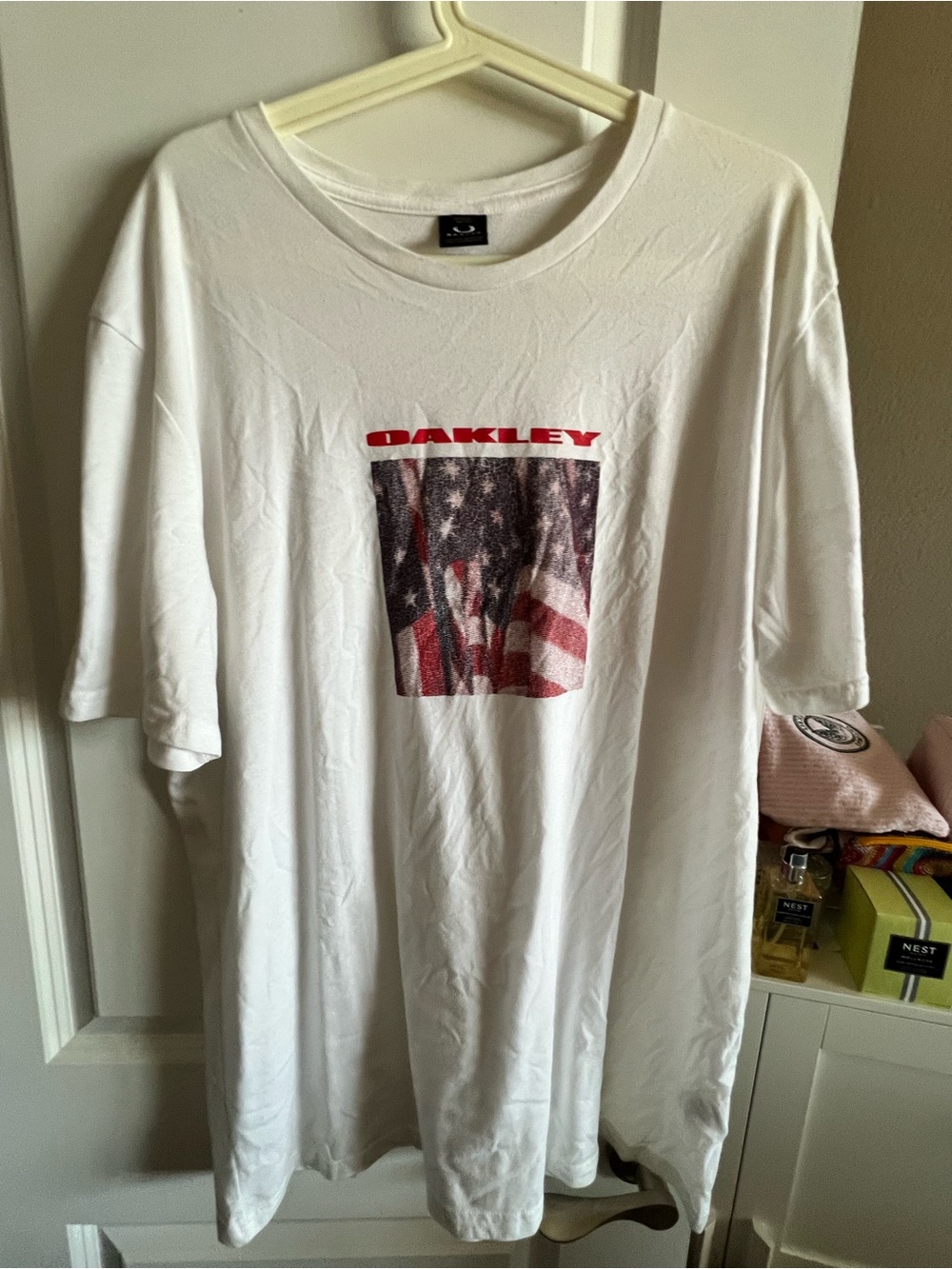 Oakley White Short-Sleeve Tee with Red Logo and Flag Graphic